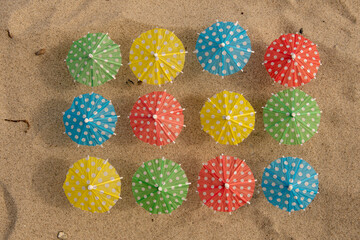(cocktail) umbrellas on the beach