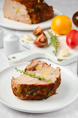 Closeup view of slice of pork neck roasted in oven