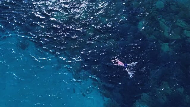 Refreshing swim at coral reef waters of Cala Coticcio Caprera Sardinia