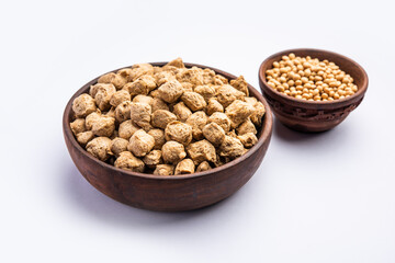 Glycine max or Soya bean or uncooked soybean chunks. Served in a bowl or as a Pile. selective focus