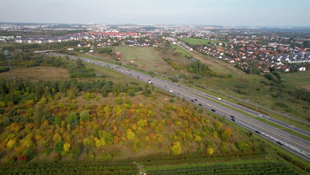 Straszyn, Gdansk - Aerial Plantation Field and Autumn Colorful Landscape by Busy Highway and Village Skyline 