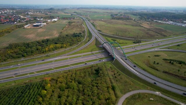 Expressway S6 Through Countryside Landscape Of Straszyn In Northern Poland - aerial orbit shot