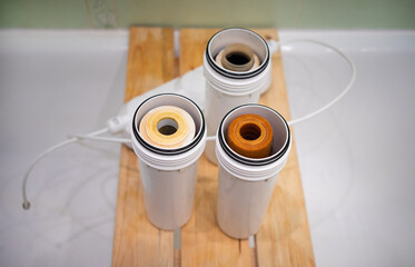 Replacement of filters for cleaning drinking water from the tap. Cleaning of tap water at home.