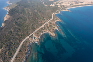 Aerial view of kemikli bay in canakkale with beautiful blue sea and interesting rock forms and sunken boats from world war 1