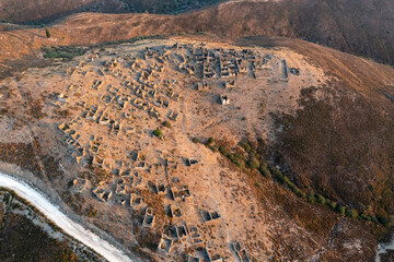 Aerial view of abandoned stone made greek town named Sazak 