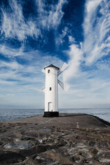 Old windmill lighthouse in Swinoujscie, a port in Poland on the Baltic Sea.