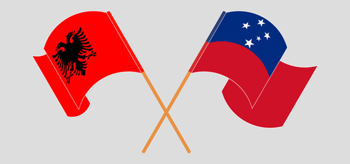 Crossed and waving flags of Albania and Samoa