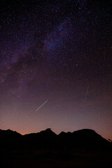 Astro shot of the night sky in Joshua Tree, view of the mountains in background