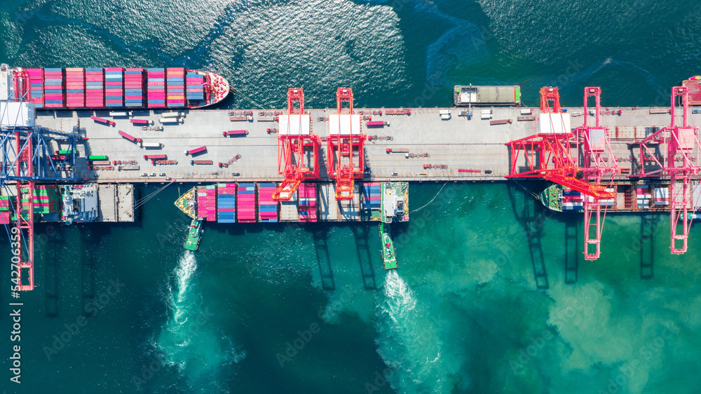 Wall mural cargo container ship running to bridge cargo shipyard container ship under the crane sea port servic