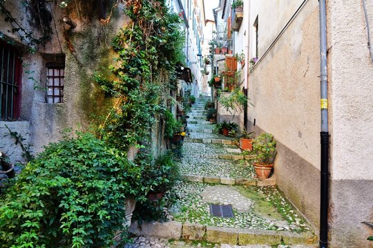 A small street between ancient buildings in Atina, a historic town in the province of Frosinone, Italy.