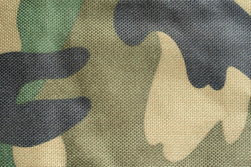 Simple dark green military camouflage pattern, synthetic army camo material background, generic...