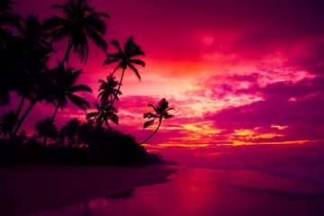 Fototapeten Tropical ocean beach with coconut palm trees silhouettes at dusk after colorful sunset © nevodka.com