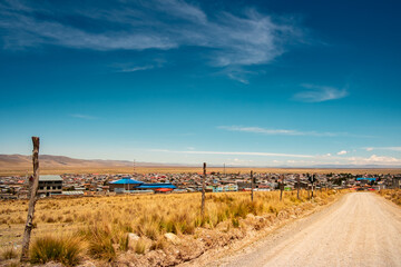 view of the eastern part of the city of Junin, in the peruvian Andes, from a gauge road