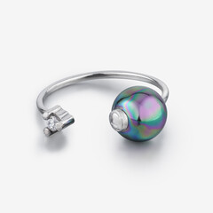 silver ring on light gray background with pearl