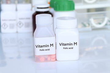 Vitamin M pills in a bottle, food supplement for health