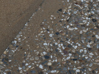 Diagonal border between sand and stones