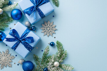 New Year concept. Top view photo of gift boxes with bows blue and silver baubles snowflake...