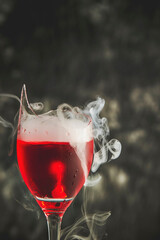 Alcohol and smoke in broken glass	