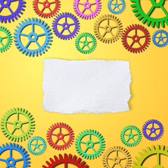Blank white torn paper with set of colorful gears