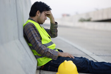 Asian construction workers tired sad from stress from hard-working