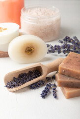 SPA. Lavender flowers, scrub and handmade soap. Natural herbal cosmetics with lavender flowers on a white texture background.FLET LAY © Avocado_studio