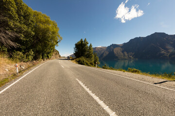Scenic Lakeside road with mountain background