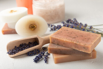 SPA. Lavender flowers, scrub and handmade soap. Natural herbal cosmetics with lavender flowers on a white texture background.FLET LAY © Avocado_studio