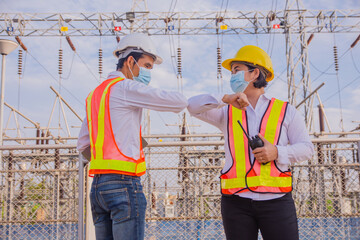Teamwork Electrician Engineer standing on factory power plant, Teamwork  Electrician Engineer...