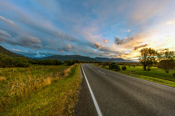 Scenic Lakeside road with mountain background