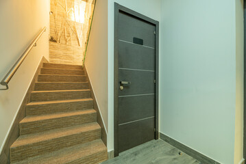 Stairs with fiber carpet and lockable junk room