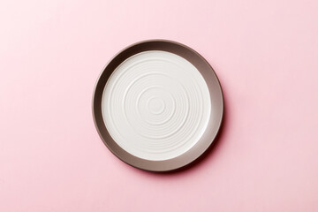 Top view of isolated of colored background empty round white plate for food. Empty dish with space for your design