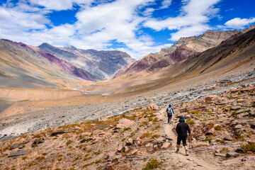 Man hiking on beautiful Pin bhabha pass trail crossing through spiti valley in Himalayas mountains with backpack. Travel Lifestyle wanderlust concept	