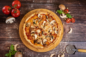 Pizza funghi with tomato sauce, mozzarella and fresh mushrooms