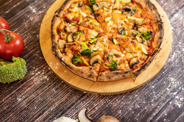 Pizza vegetables with tomatoes, mozzarella, peppers, spinach and zucchini
