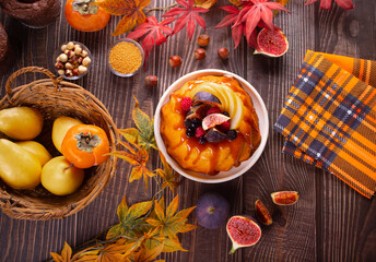 Delicious homemade autumn cake with figs and frozen berries for celebrating Thanksgiving day or Halloween