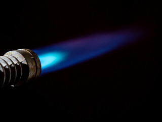 Gas burner flame. Blue fire isolated on black background.