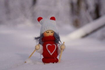 Toy angels on skis in a snowy forest.  Fabulous Christmas figurines.