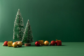 Festive Christmas scene podium for products showcase, promotional sale, minimalist green background - obrazy, fototapety, plakaty