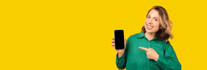 Yellow banner photo with a smiling blonde woman pointing at her blank phone screen.