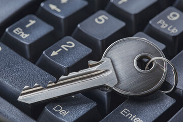 Protecting personal data and money , key on computer keyboard.