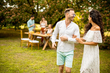 Young couple walking in the garden