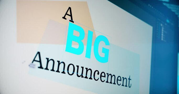 A digital artist creates a graphic saying "A BIG Announcement" on a page layout computer program.
