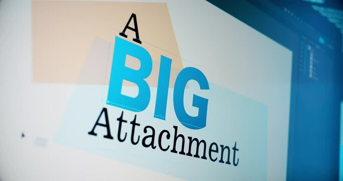 A digital artist creates a graphic saying "A BIG Attachment" on a page layout computer program.
