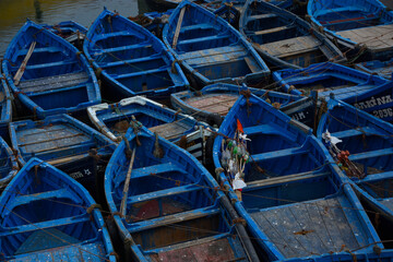 Blue fishing boats parked in the port in Morocco in the city of Essaouira