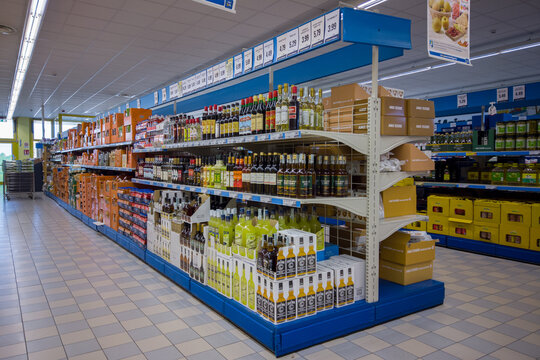 Fossano, Cuneo, Italy - October 29, 2022: shelves with bottles of liqueurs and spirits in the Eurospin discout store supermarket
