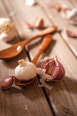 red garlic from sicily on wooden table - closeup