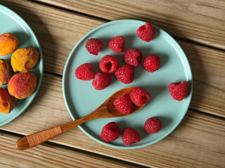 pile of fresh raspberries - organic fruit - closeup