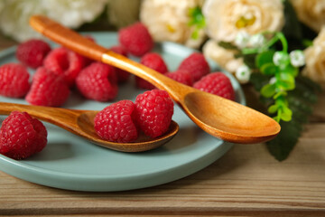 pile of fresh raspberries - organic fruit - closeup
