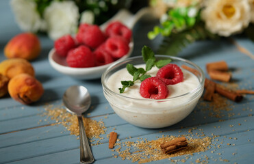 raspberry yogurt in the glass bowl - closeup