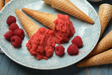 homemade raspberry ice cream with fruits around - closeup